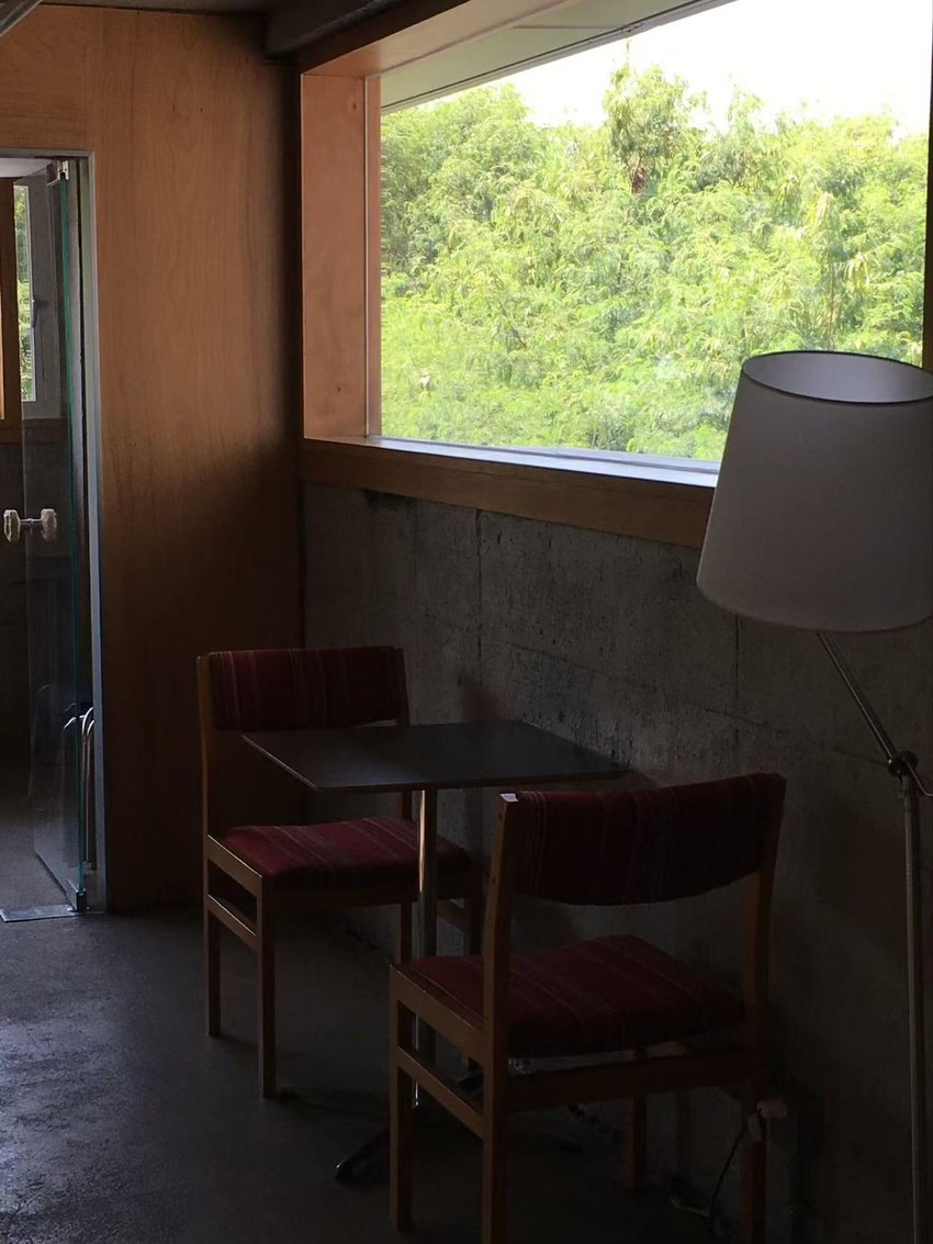Warm café interior with a tiled floor and a small table